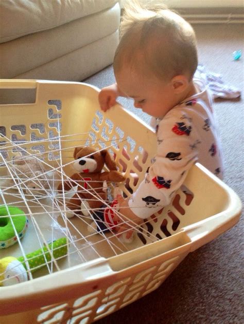 I'll be sharing some simple play ideas for babies that are 10 months old. Spinnennetz-Spiel | Infant activities, Baby sensory play ...
