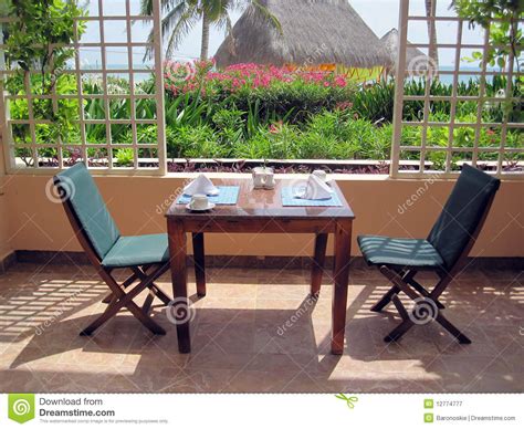 Restaurant tables and chairs are clearly at the heart of any dining space. Restaurant Patio Dining Table Stock Image - Image of ...