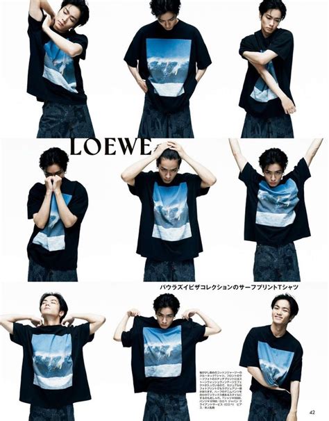 An Image Of A Man Posing With His Hands On His Head And Wearing A T Shirt That Says Loewe