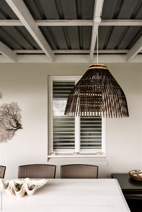 Dining Table On An Outdoor Verandah Of A Beach House By Stocksy Contributor Gillian Vann