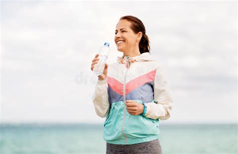 Woman Drinking Water After Exercising At Seaside Stock Image Image Of