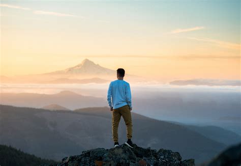 Man Standing On Top Of Mountain Image Free Stock Photo