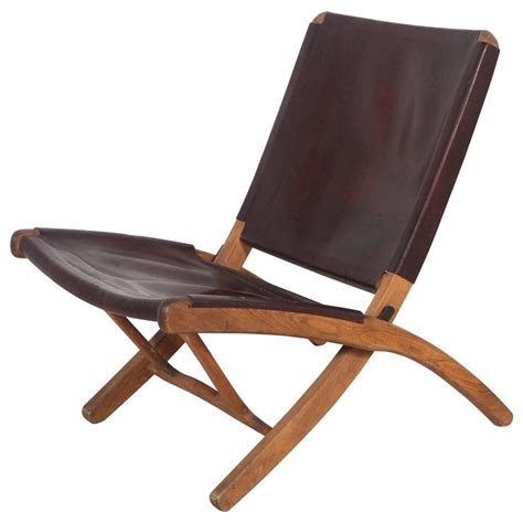 Solid wood lounge chair, black walnut with armrests, luxury leather single sofa, living room balcony vantiggelen $ 82.77 free. Italian Leather and Wood Folding Chair at 1stdibs