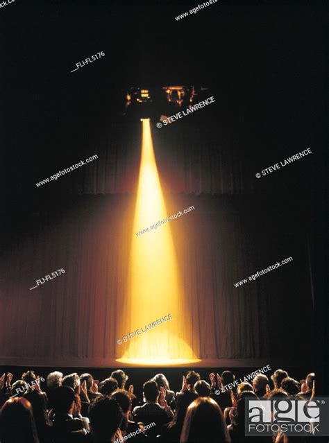 Yellow Spotlight Shining On Empty Theatre Stage Audience Clapping