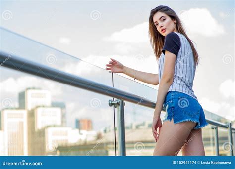Girl In Shorts On The Balcony In A Cafe Summer Portrait Of Young Stylish Girl Posing On Balcony