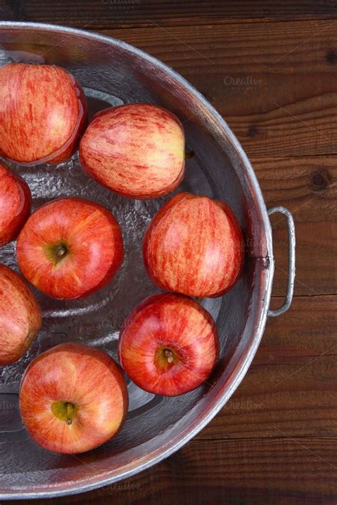 The game is played by filling a tub or a large basin with water and putting apples in the water. Apple Bobbing Tub Vertical | Halloween games for kids ...