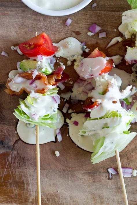 We all know that salads can sometimes be difficult to take with you during the summer, but all you have to do is put your favorite salad recipe (green or fruit) on a stick and pack a container of dressing to go. Wedge Salad Skewers | love & zest