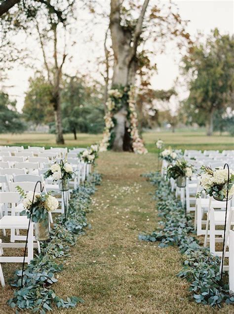 Greenery Lined Aisle At Outdoor Wedding Ceremony Ceremony Decorations