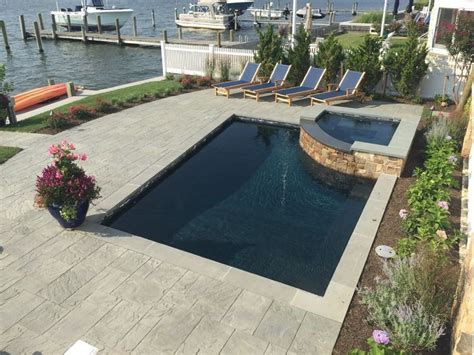 Pebble sheen blue granite | desert white tumbled vein cut travertine. Pebble Fina Pool Finishes | Pool finishes, Pool, Outdoor