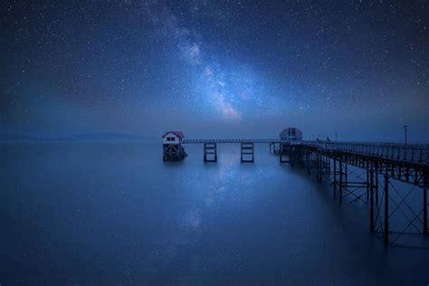 Vibrant Milky Way Composite Image Over Landscape Of Old Pier Str