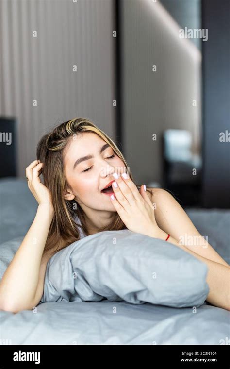 Sleepy Blonde Woman Yawning Sitting Hi Res Stock Photography And Images