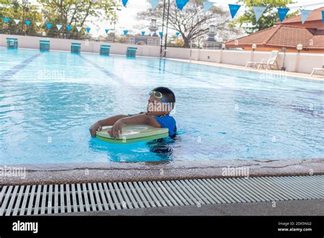 Boy Practicing At Swimming Pool Stock Photo Alamy