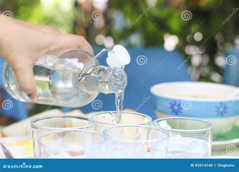 Stock Photopouring Water From Bottle Into Glass Stock Photo Image Of