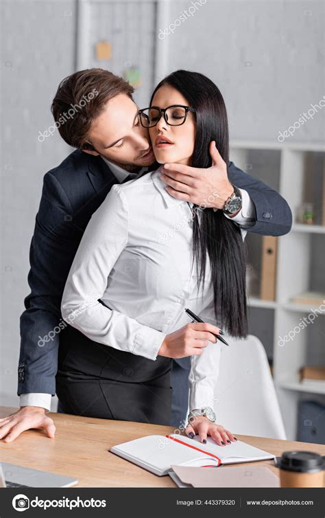 Businessman Seducing Sexy Brunette Secretary Standing Pen Workplace