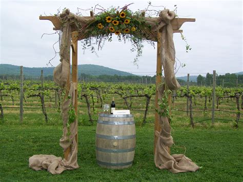 Decorate your altar with a wedding arch or wedding arbor in a style that matches your wedding vision wedding arches have long been used to enhance—and even transform!—ceremony spaces. Decorated Wedding Arch with Burlap and Sunflowers. Perfect ...
