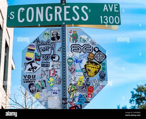 South Congress Ave Street Sign With Decal Plastered Stop Sign In Austin