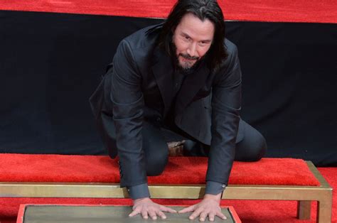 Actor Keanu Reeves Hand And Footprints Immortalized In Front Of