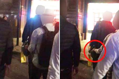 Moment Team Of Pickpockets Caught In Action On Camera As One Reaches Into Victims Bag Near
