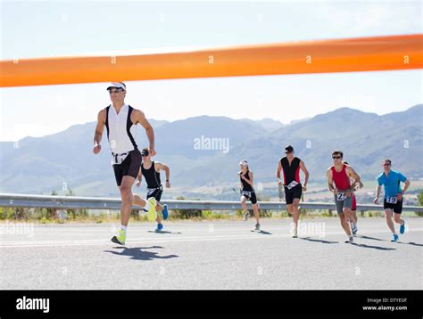 Runners Crossing Race Finish Line Stock Photo Alamy