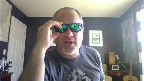 spy optics sunglasses dirk with shiny black frame happy bronze polarized lens with green