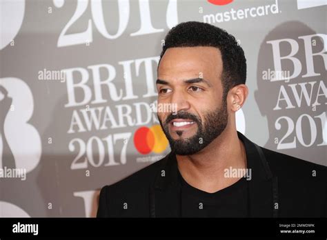 Singer Craig David Poses For Photographers Upon Arrival At The Brit