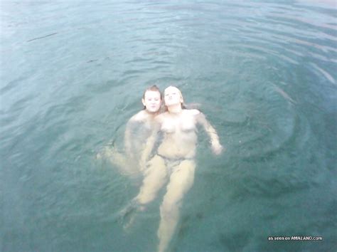 Lesbian Teens Having Fun Taking A Dip While Nude Outdoors