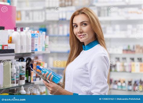 Female Pharmacist Working At Her Drugstore Stock Photo Image Of