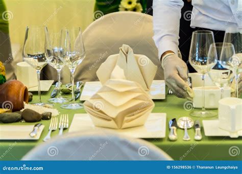 Waiter Decorate And Setting Party Dinner Table In Restaurant Stock