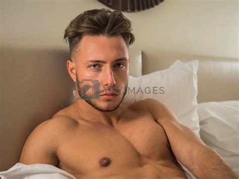 Shirtless Sexy Male Model Lying Alone On His Bed By Artofphoto Vectors Illustrations With
