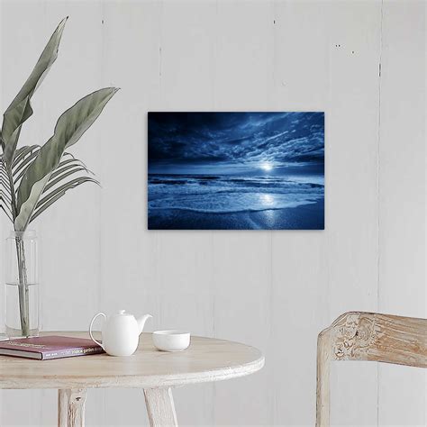 Midnight Blue Coastal Moonrise With Dramatic Sky And Rolling Waves Wall