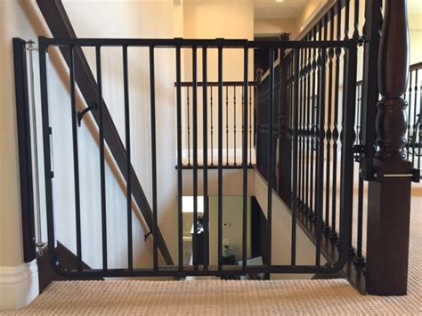 Baby gate for stair with banisters. Black Child Safety Stair Gate Installation | Baby Safe Homes