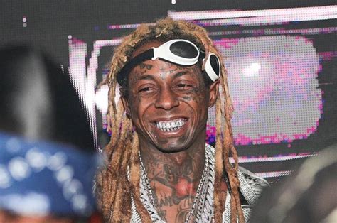 Trump Pardons Rapper Lil Wayne