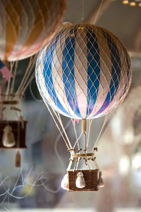Construct miniature hot air balloons for your party. I.De.A: Hot air balloons in the kid's room