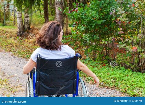 A Paralyzed Girl In A Wheelchair Prepares To Run Over The Border In