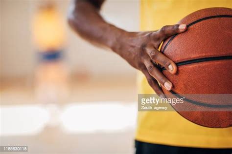 Black Hand Holding Ball Photos And Premium High Res Pictures Getty Images