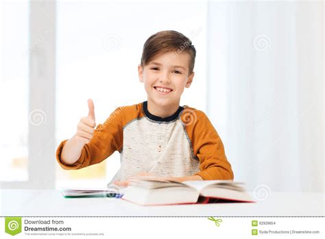Happy Student Boy With Textbook Showing Thumbs Up Stock Photo Image