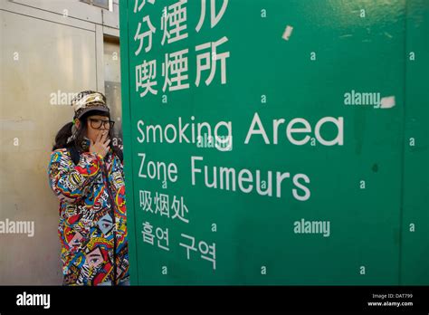 Young Woman At Smoking Area Outside Shibuya Station Tokyo Japan Stock