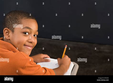 Portrait Of A Boy Writing Stock Photo Alamy