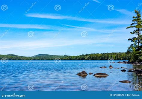 Rocks And Shore Of Branch Lake In Maine In The Summertime Stock Photo