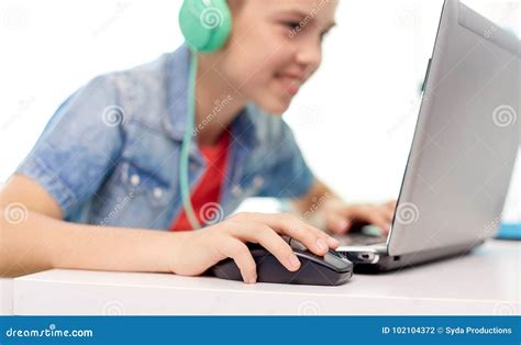 Boy In Headphones Playing Video Game On Laptop Stock Photo Image Of