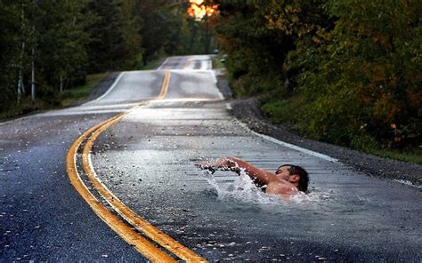 Man Swimming In Pave Road Illusion Photo Swimming Photo Manipulation