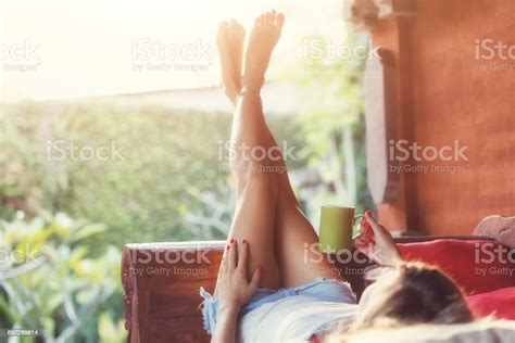 Girl Drinking Coffee Tea And Enjoying The Sunrise Sunset In Garden