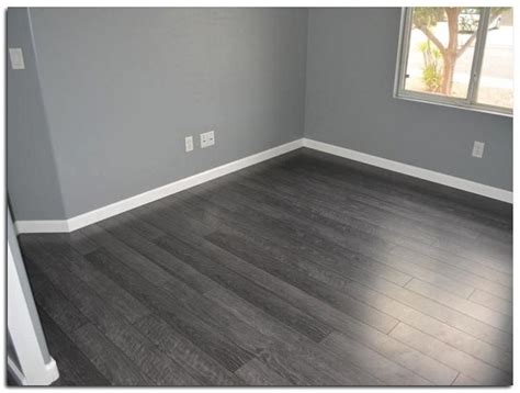 Corner of stylish bedroom with grey walls wooden floor king. 40 Fabulous Laminate Floor for Living Room Design Ideas ...