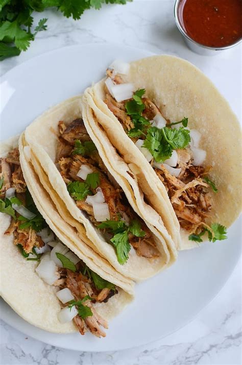 The meat will start frying in its own fat and lard at this point. Slow Cooker Carnitas Street Tacos - Fake Ginger