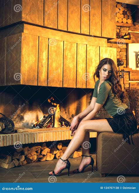 Pretty Brunette Posing Near Burning Fireplace Stock Photo Image Of