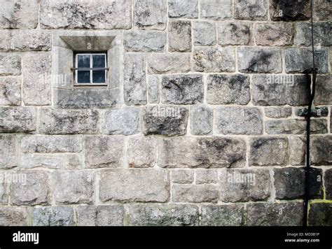 Old Church Stone Wall With Small Window Texture Background Stock Photo