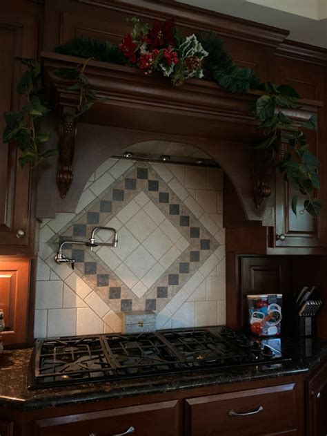 Range hood mounting height differs for indoor and outdoor hoods. Kitchen Hood Height Dilemma