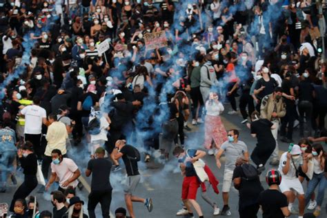 Paris Police Use Tear Gas Against Protesters As Global Outrage
