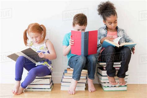 Barefoot Students Reading Books Stock Photo Dissolve