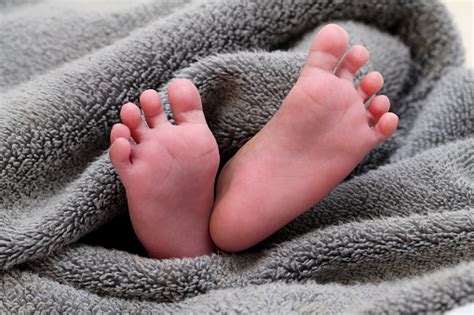 Close Up Of Tiny Foot Of Newborn Baby Stock Photo Download Image Now
